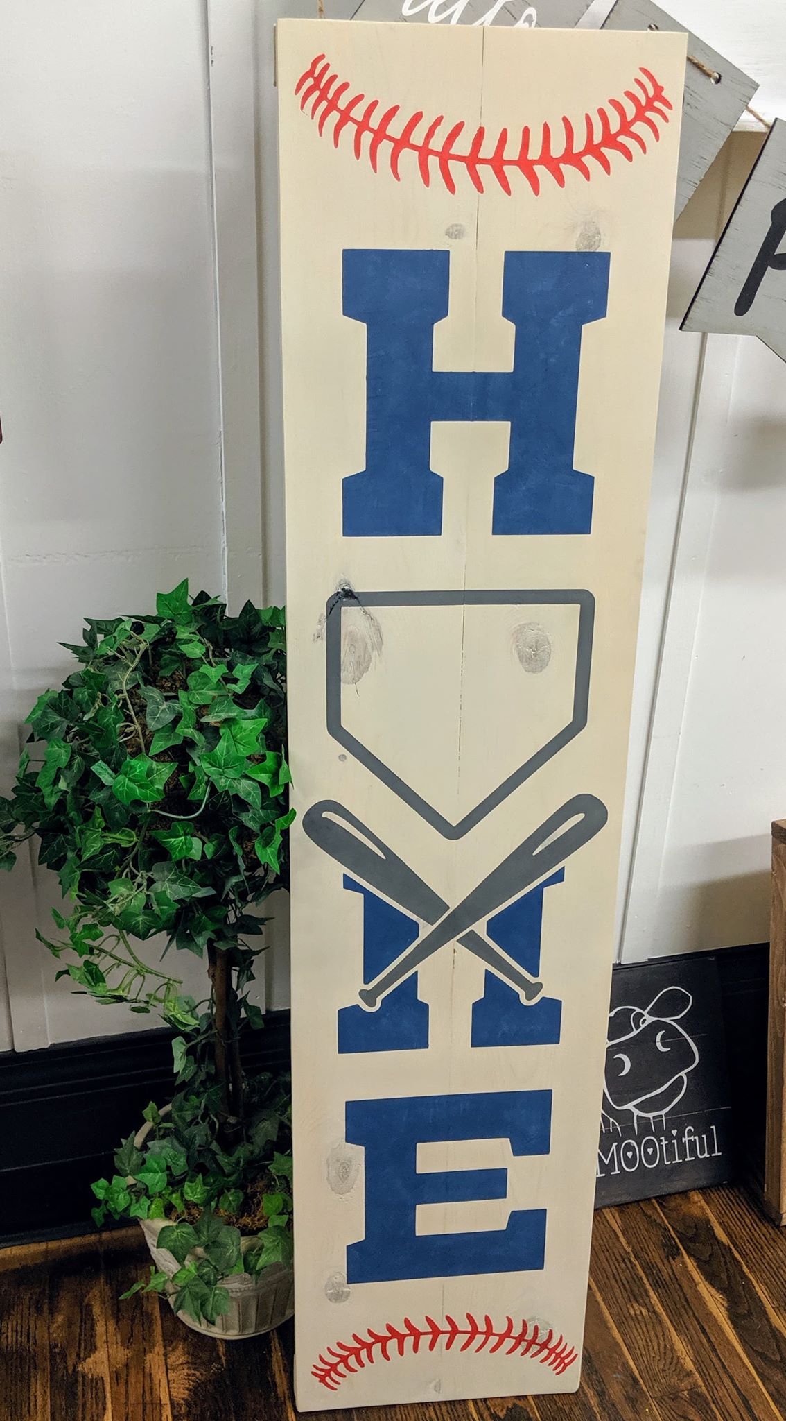 Home baseball with crossing bats