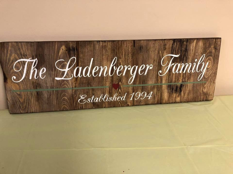 Family last name with line and heart est